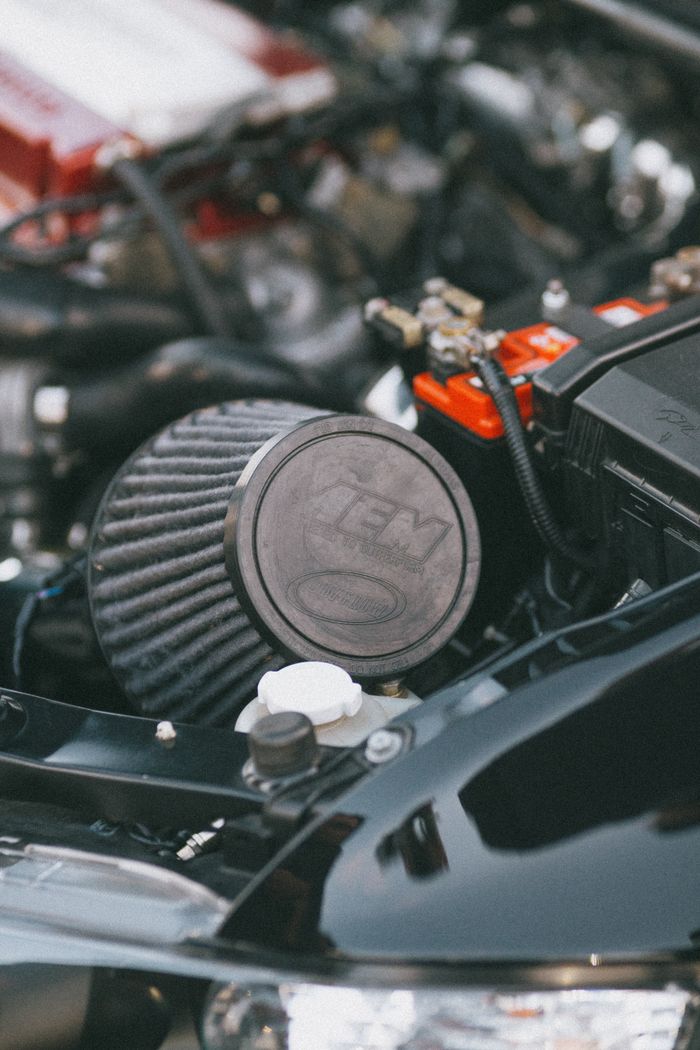 Detailed view of a car engine showcasing the air filter and engine components.